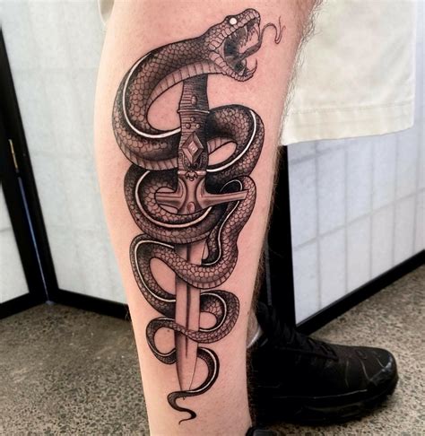 snake leg tattoo men.